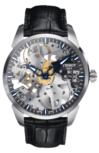 Tissot watch with mechanical movement parts visble on the watch face and a black leather watch strap