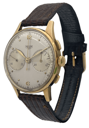 Tag Heuer Watch with a leather strap and gold watch casing.